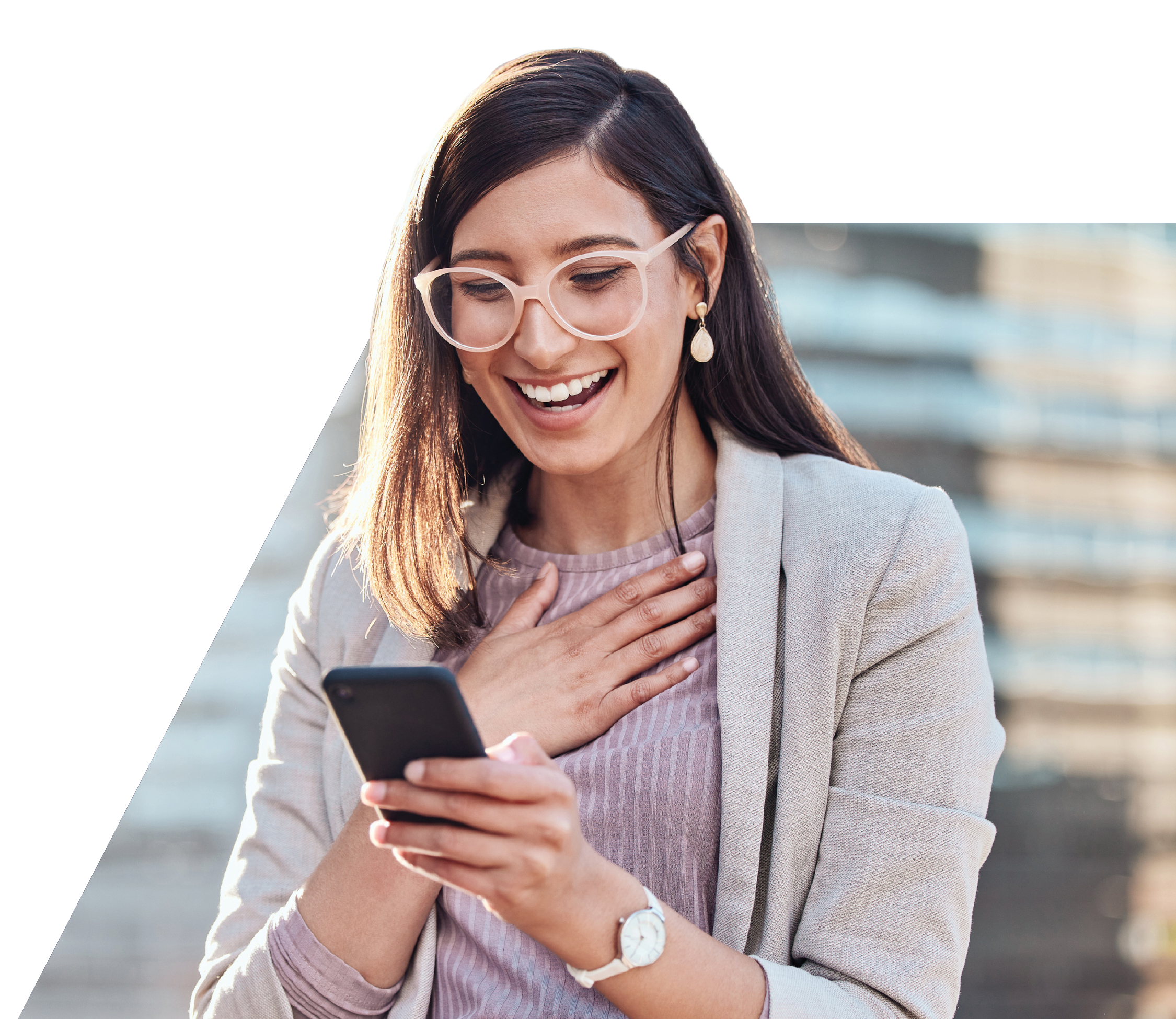 Woman looking at phone excited about home listings