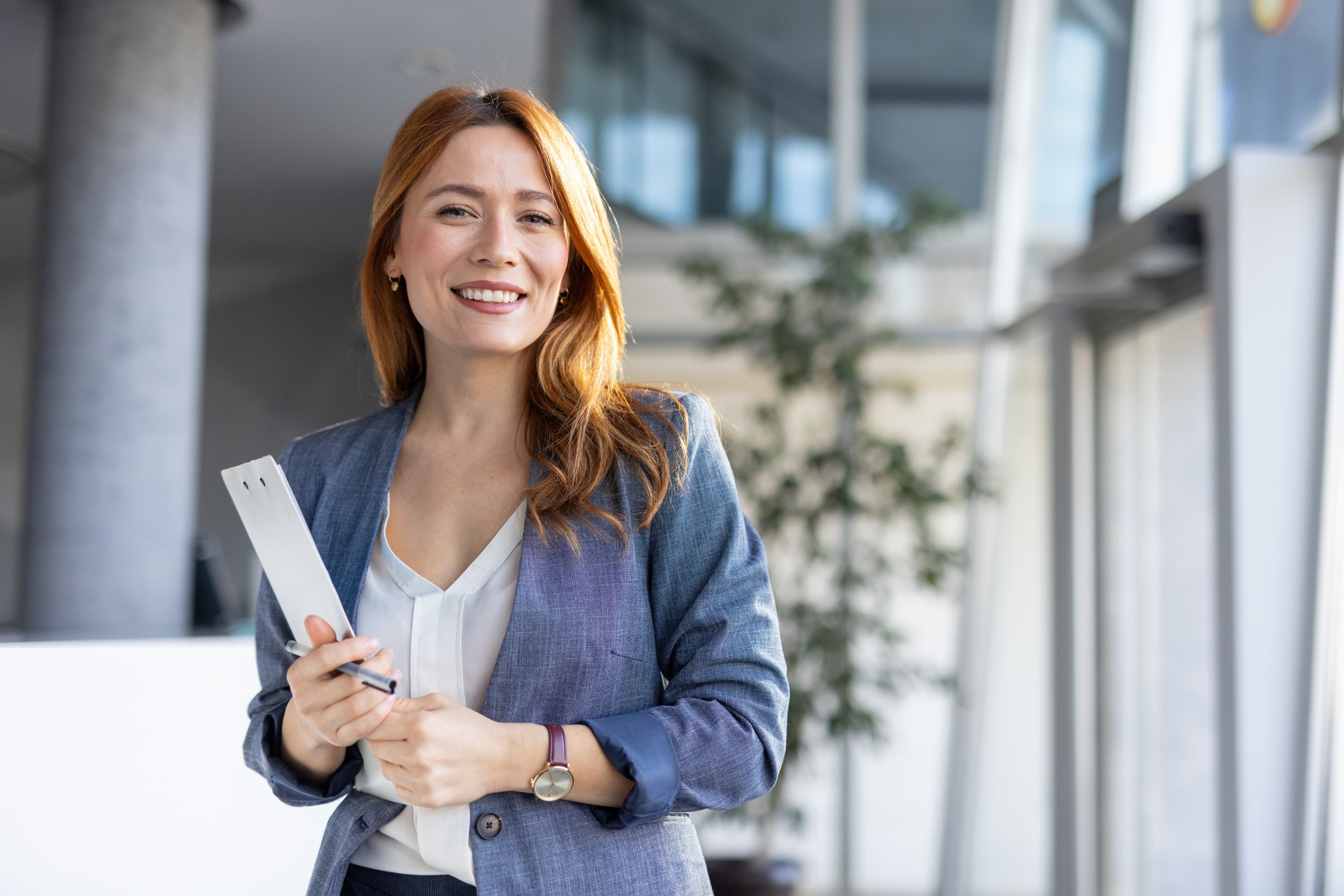Real estate agent with clipboard ready to help